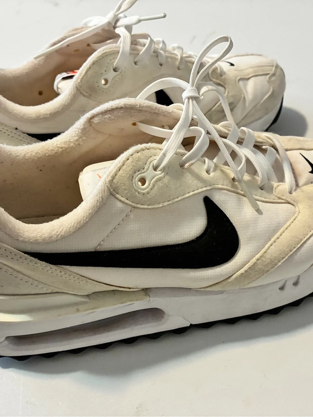 Nike Air Max Dawn sneakers in a White/Total Orange/Black colorway